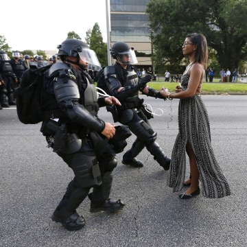Image: Protestor Ieshia Evans is detained by law enforcement near the headquarters of the Baton Rouge Police Department