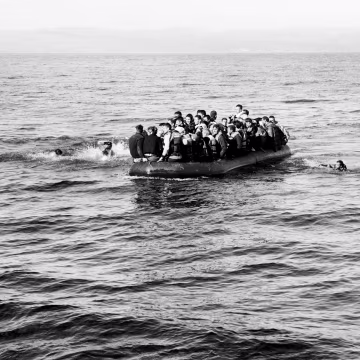 Photographer Giles Duley believes there is a chance to make a difference with even one picture. The London native was working in Sangsar, Afghanistan when he stepped on a landmine. He has endured more than 30 operations in the five years since.


Above: An overcrowded boat of refugees heads to the shore. Two men had fallen from the boat; they were rescued by volunteer Spanish Lifeguards in Lesvos on Oct. 28.