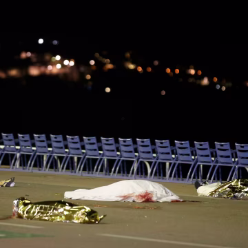 Image: Bodies are seen on the ground after a heavy truck ran into a crowd at high speed killing scores celebrating the Bastille Day July 14 national holiday on the Promenade des Anglais in Nice