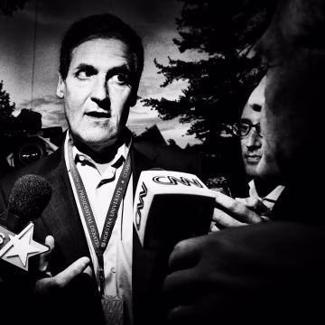 Mark Cuban talks to a crowd of reporters.