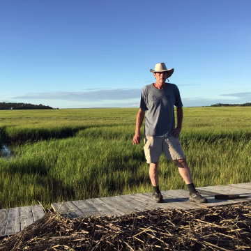 Kevin Mellogy of Little Piney Island in Fernandina Beach, Florida, stands on a section of his dock on Oct. 8 that was blown three quarters of a mile away from his house by Hurricane Matthew. \"I spotted it with my telescope,\" he says, \"Some of it probably washed back out. God knows where it is.\"