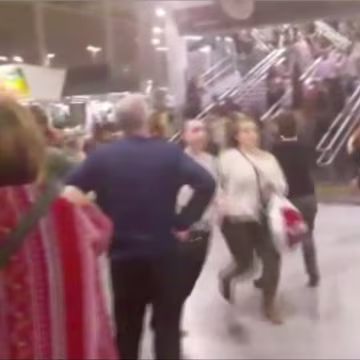 Image: People running down stairs as they attempt to exit the Manchester Arena after a blast on Monday