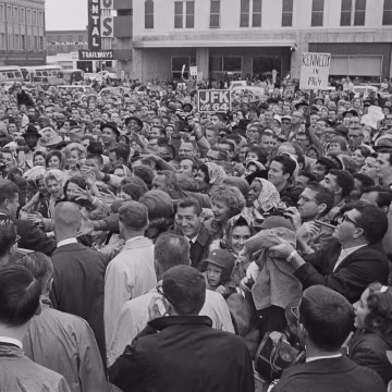 Image: President John F. Kennedy is greeted by an enthusiastic crowd in front of the Hotel Texas in Fort Worth