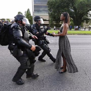 Image: Protestor Ieshia Evans is detained by law enforcement near the headquarters of the Baton Rouge Police Department