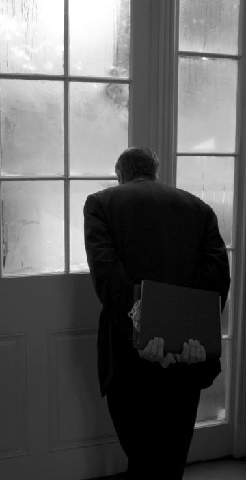 Image: NBC's Brian Williams looks out onto the Rose Garden from the West Wing's Palm Room. He was preparing for the president's arrival and the start of a day spent reporting a behind-the-scenes documentary at the White House