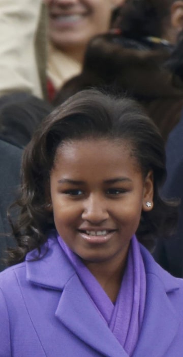 Image: The daughters of President Barack Obama, Sasha and Malia, arrive for the swearing-in ceremonies for their father on the West Front of the U.S. Capitol in Washington