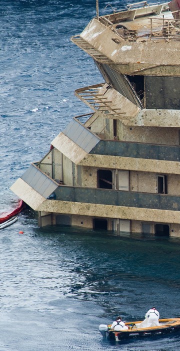 Image: The stricken Costa Concordia is visible after the parbuckling operation successfully uprighted the ship