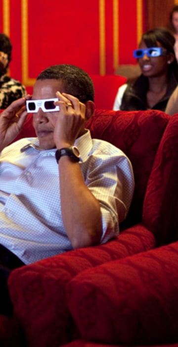 President Barack Obama and First Lady Michelle Obama wear 3-D glasses while watching Super Bowl 43, Arizona Cardinals vs. Pittsburgh Steelers, at a Super Bowl Party in the family theater of the White House. Guests included family, friends, staff members and bipartisan members of Congress, 2/1/09. Official White House Photo by Pete Souza