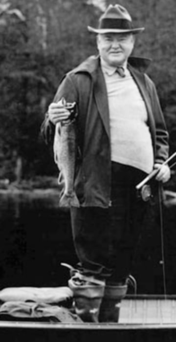Herbert Hoover stands as he fishes the Chesapeake Bay near Crisfield, Md., Aug. 16, 1932. The preisdent caught 15 trout, one of them reportedly three feet long, on the fishing expedition. (AP Photo)