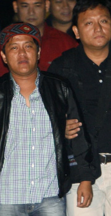 Image: Agents of the National Bureau of Investigation escort Ampatuan Jr in Pasay city, metro Manila