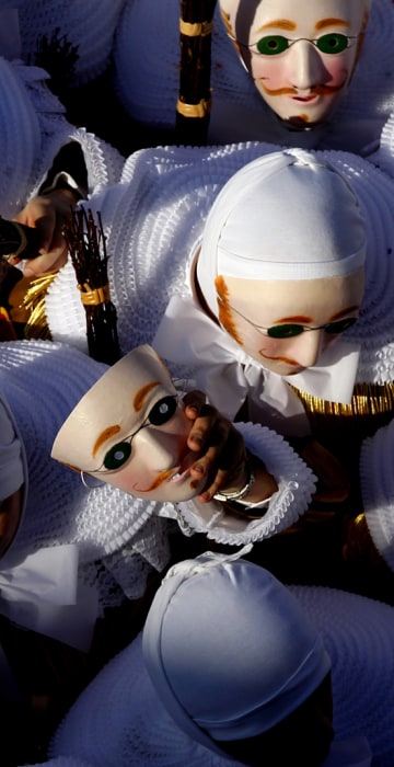 Image: The Gilles of Binche take part in the carnival parade in Binche