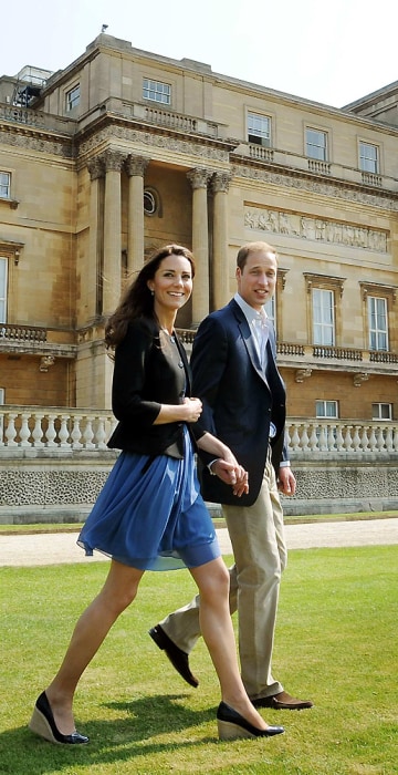 Image: Britain's Prince William and Catherine, Duchess of Cambridge, walk together in Buckingham Palace in central London