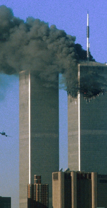 On Sept. 11, 2001, hijackers caught US authorities by surprise with a bold attack on New York City's World Trade Center. At 8:46 a.m., American Airlines Flight 11 carrying 92 people, speared into the 110-story north tower. At 9:03 a.m., United Airlines Flight 175, carrying 65 people, crashed into the 84th floor of the south tower.   

END msnbc.com caption. 

Hijacked United Airlines Flight 175 (L) flies toward the World Trade Center twin towers shortly before slamming into the south tower (L) as the north tower burns following an earlier attack by a hijacked airliner in New York City September 11, 2001. The stunning aerial assaults on the huge commercial complex where more than 40,000 people worked on an ordinary day were part of a coordinated attack aimed at the nation's financial heart. They destroyed one of America's most dramatic symbols of power and financial strength and left New York reeling.     FIRST OF SEVEN  PHOTOGRAPHS                            REUTERS/Sean Adair