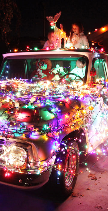 Image: A 1965 Chevy pick-up truck decorated for Christmas.