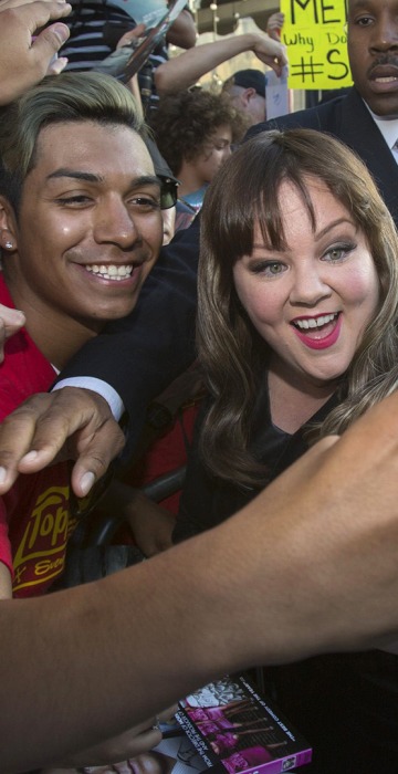 Image: Cast member McCarthy poses with a fan at the premiere of \"Tammy\" at the TCL Chinese theatre in Hollywood