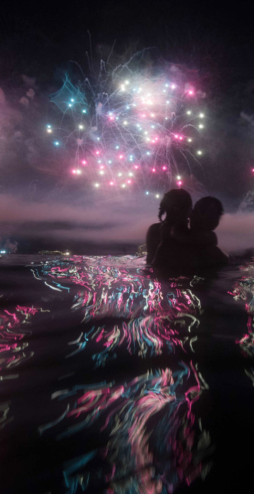 Image: A couple watches fireworks just after New Years at Copacabana beach
