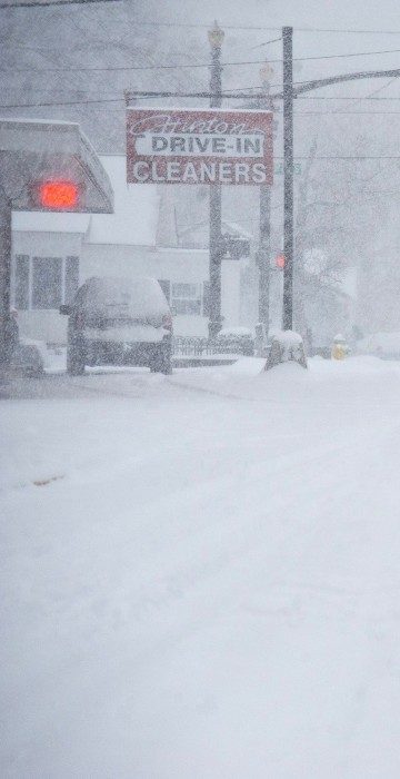 Image: A person walks through the blowing snow in Bowling Green, Ky.