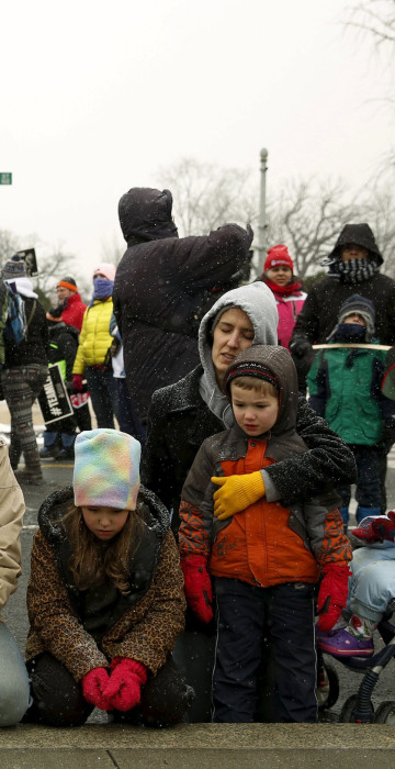 Image: DiIulio family from Fairfield, Pennsylvania prays in front of Supreme Court in Washington