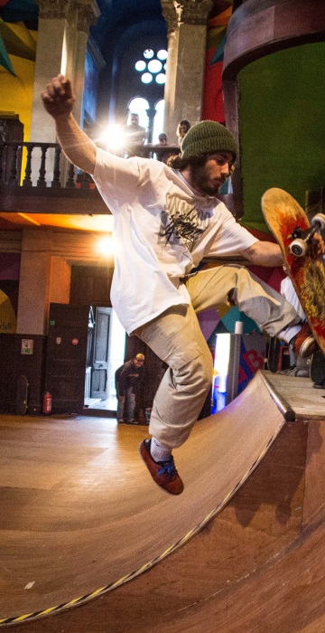 Image: A skater practices in a skate park inside the Santa Barbara church