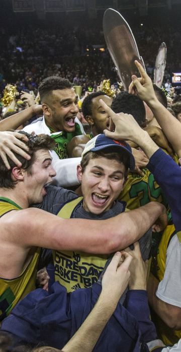Image: Notre Dame’s Steve Vasturia celebrates on the court with fans