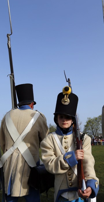 Image: People dressed as Austrian soldiers of the Habsburg dynasty take part in the re-enactment of the battle against Hungary in Tapiobicske