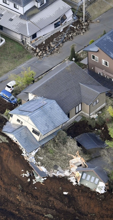 Image: Houses are buried in landslide caused by an earthquake