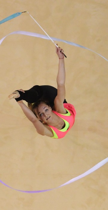 Image: A gymnast takes part in an open training session for the rhythmic gymnast
