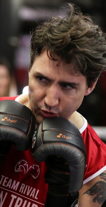 Image: Canadian Prime Minister Justin Trudeau dodges a punch as he spars in the ring at Gleason's Boxing Gym in the Brooklyn borough of New York