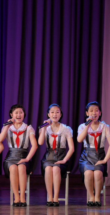 Image: Girls perform on the stage of the Mangyongdae Children's Palace in central Pyongyang