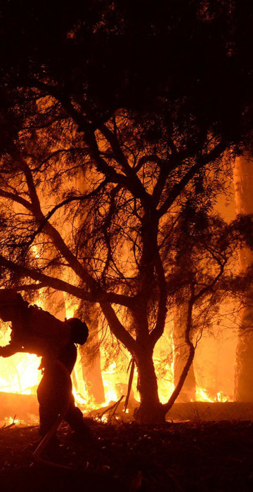 Image: Handout photo of a firefighter battling the Sherpa Fire in Santa Barbara, California