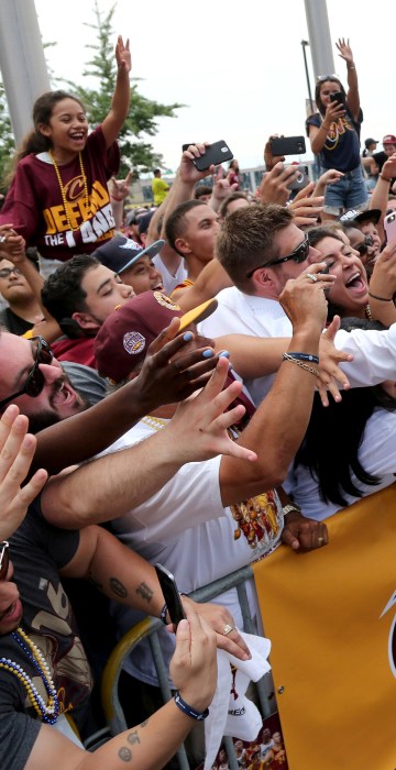 Image: Cleveland Cavaliers Iman Shumpert celebrates with the crowd in downtown Cleveland