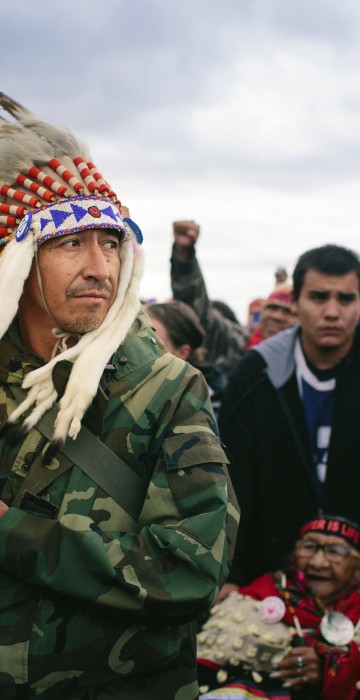Image: Catcher Cuts The Road, an Army veteran, leads a protest march to a sacred burial ground at the Standing Rock Indian Reservation in North Dakota.