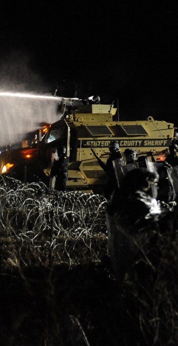 Image: Police use a water cannon on protesters during a protest against plans to pass the Dakota Access pipeline near the Standing Rock Indian Reservation, near Cannon Ball, North Dakota, U.S.