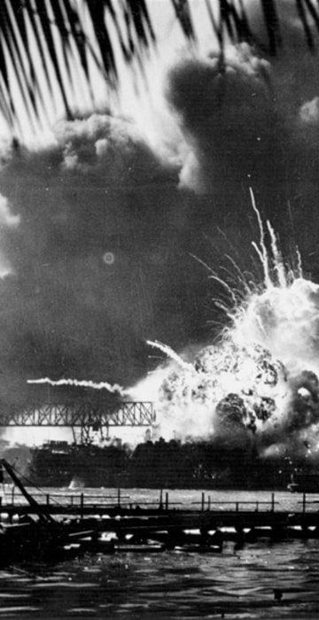 Image: The American destroyer USS Shaw explodes during the Japanese attack on Pearl Harbor.