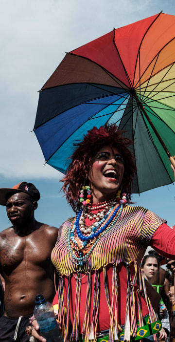 Image: Revelers take part in the 21st Rio LGBT pride parade at Copacabana beach in Rio de Janeiro