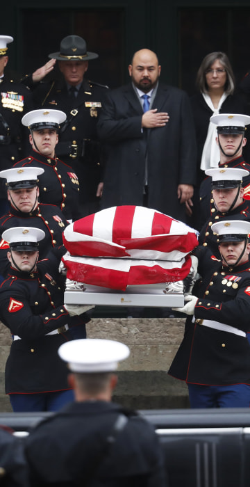 Image: The casket of John Glenn is carried out of the Ohio Statehouse by Marines during his funeral procession, Dec. 17, in Columbus, Ohio.