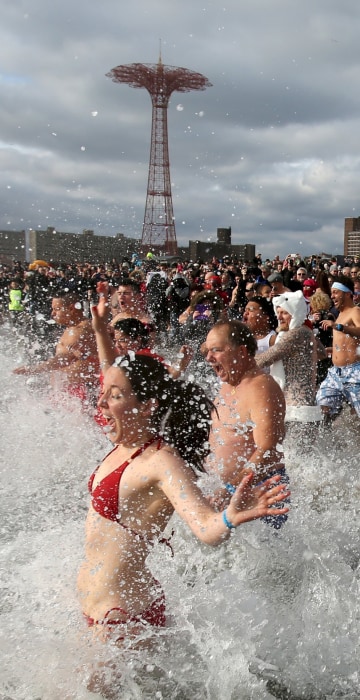 Image: Participants enter the water during the Coney Island Polar Bear Club's annual New Year's Day swim at Coney Island in the Brooklyn borough of New York.