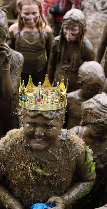 Image: Brian Wilson, 10, of Redford, smiles after he was crowned Mud Day King