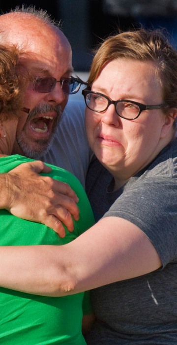 Image: Tom Sullivan embraces family members