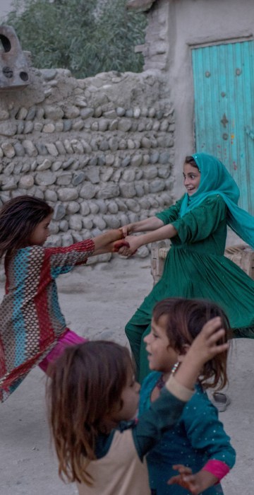 Image: Afghan children play at their home