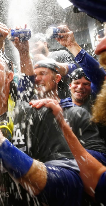 Image: Chase Utley #26 of the Los Angeles Dodgers celebrates in the clubhouse