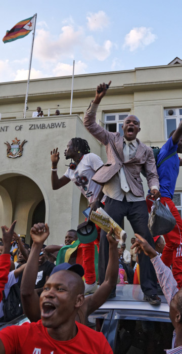 Image: Zimbabweans celebrate outside the parliament building