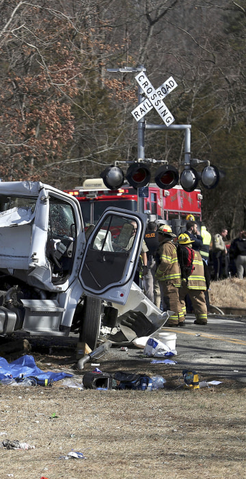 Image: Emergency personnel work at the scene of a train crash in Crozet