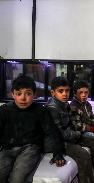 Injured children receive medical treatment after bombings on Mesraba on Feb. 19.