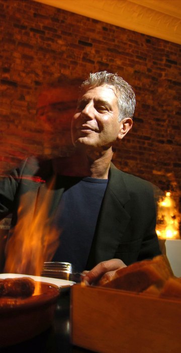 Image: Chef Anthony Bourdain has a drink at Tintol restaurant in Ti