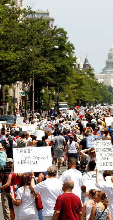 Image: Immigration activists march to protest the Trump Administration's immigration policy in Washington