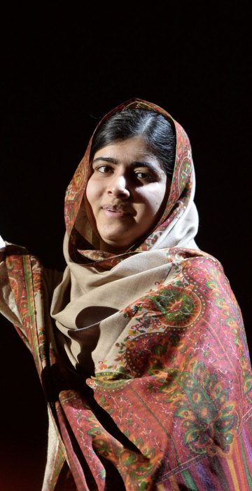 Baby Liberty dressed as Malala Yousafzai, Pakistani activist for female education and the youngest Nobel Prize laureate.