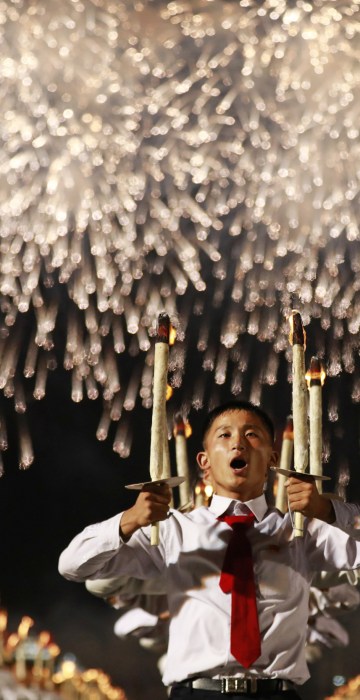Image: North Korea students torch light parade