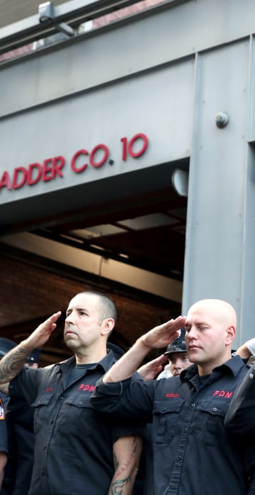 Image: Firefighters stand at attention on the 18th anniversary of the September 11, 2001 attacks in lower Manhattan in New York