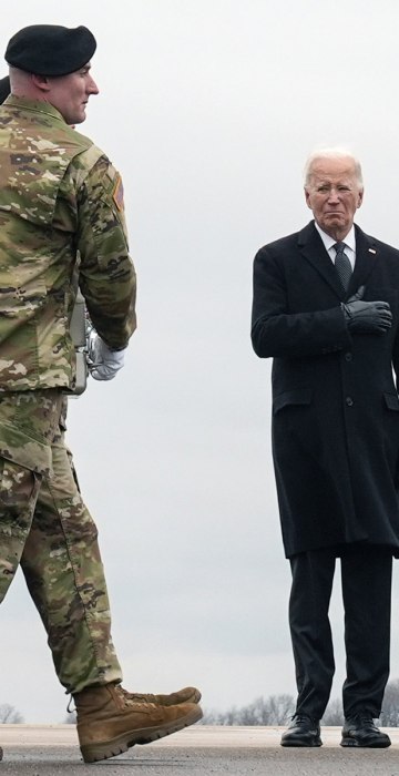 President Joe Biden stands as an Army carry team moves the transfer case containing the remains of U.S. Army Sgt. Kennedy Ladon Sanders, 24, of Waycross, Georgia., at Dover Air Force Base, Delaware, Friday, Feb. 2, 2024. Sanders was killed in a drone atta